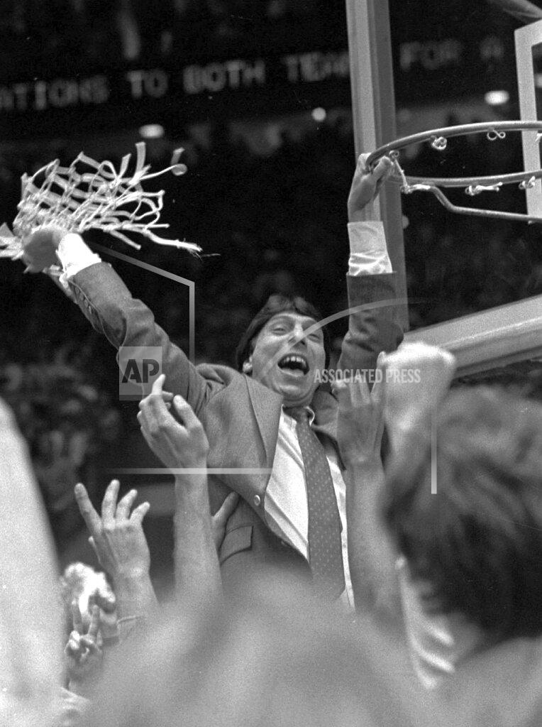 Leonard Ignelzi FILE - In this early Tuesday, April 5, 1983, file photo, North Carolina State coach Jim Valvano waves the net in victory after defeating Houston in the NCAA Final Four championship game in Albuquerque, N.M. Lorenzo Charles' dunk shot with one second remaining fulfilled North Carolina State's impossible dream, giving the Wolfpack a 54-52 victory over top-ranked Houston. (AP Photo/Leonard Ignelzi, File)