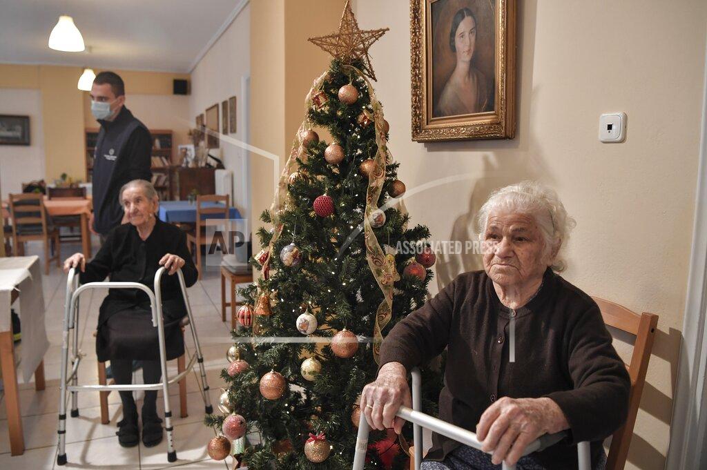 Lousia Gouliamaki Elderly women wait to get vaccinations at a nursing house in Athens, Monday, Jan. 4, 2021. Vaccinations were expanded from 9 to 50 hospitals nationwide on Monday. (Louisa Gouliamaki/Pool via AP)
