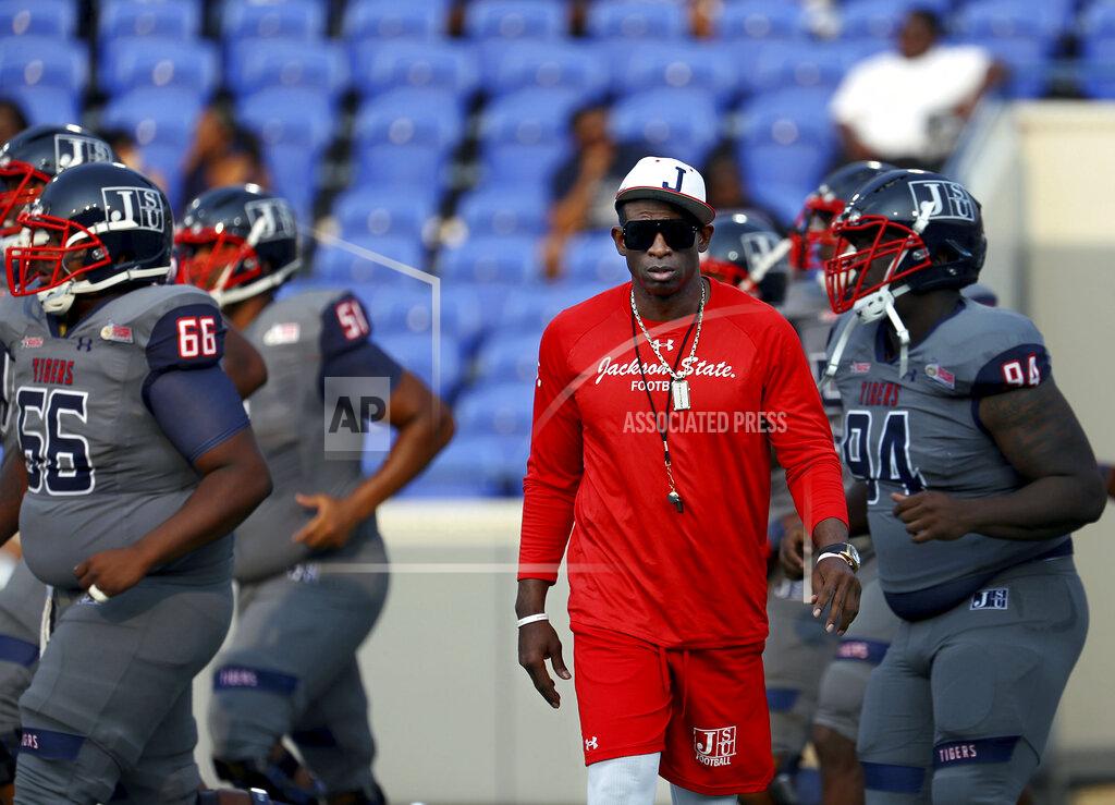 Patrick Lantrip Jackson State head coach Deion Sanders works with his players before the Southern Heritage Classic NCAA college football game against Tennessee State in Memphis, Tenn., Saturday, Sept. 11, 2021. (Patrick Lantrip/Daily Memphian via AP)