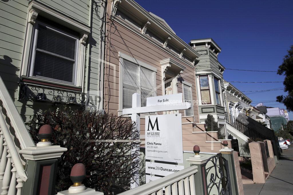 FILE - This Feb. 18, 2020, photo shows a real estate sign in front of a home for sale in San Francisco. An estimated 4.1 million Americans have their mortgage in forbearance, according to data released Monday, May 18, by the Mortgage Bankers Association.(AP Photo/Jeff Chiu, File)