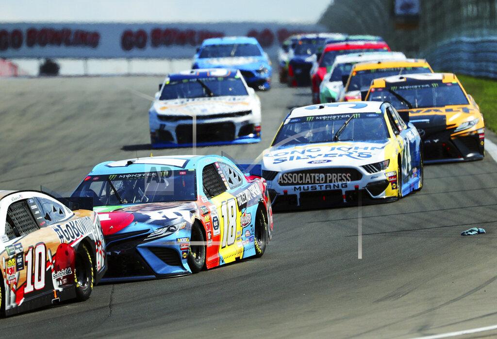 John Munson Kyle Busch (18) head into Turn 1 during a NASCAR Cup Series auto race at Watkins Glen International, Sunday, Aug. 4, 2019, in Watkins Glen, N.Y. (AP Photo/John Munson)