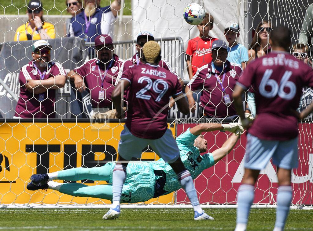 David Zalubowski Los Angeles FC goalkeeper John McCarthy, back, misses a penalty shot off the foot of Colorado Rapids attacker Gyasi Zardes (29) for a goal in the first half of an MLS soccer match Saturday, May 14, 2022, in Commerce City, Colo. (AP Photo/David Zalubowski)