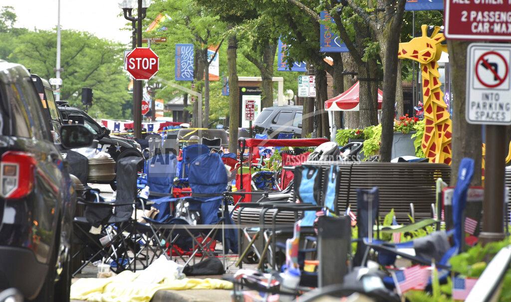John Starks Abandoned chairs on the scene of a mass shooting at a Fourth of July parade on Central Avenue in Highland Park, Ill., on Monday, July 4, 2022. (John Starks/Daily Herald via AP)