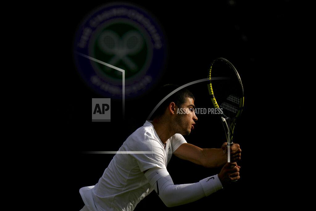 Alastair Grant Spain's Carlos Alcaraz returns the ball to Germany's Oscar Otte in a men's singles match on day five of the Wimbledon tennis championships in London, Friday, July 1, 2022. (AP Photo/Alastair Grant)