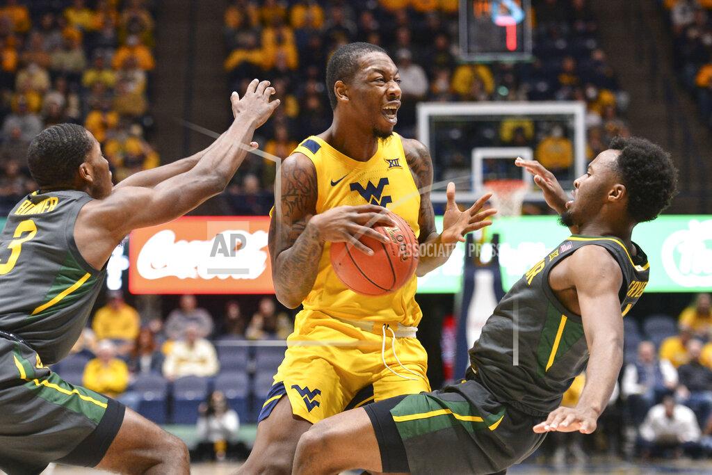 William Wotring Baylor guard LJ Cryer (4) is called for a foul while guarding West Virginia forward Gabe Osabuohien (3) during the first half of an NCAA college basketball game in Morgantown, W.Va., Tuesday, Jan. 18, 2022. (William Wotring)