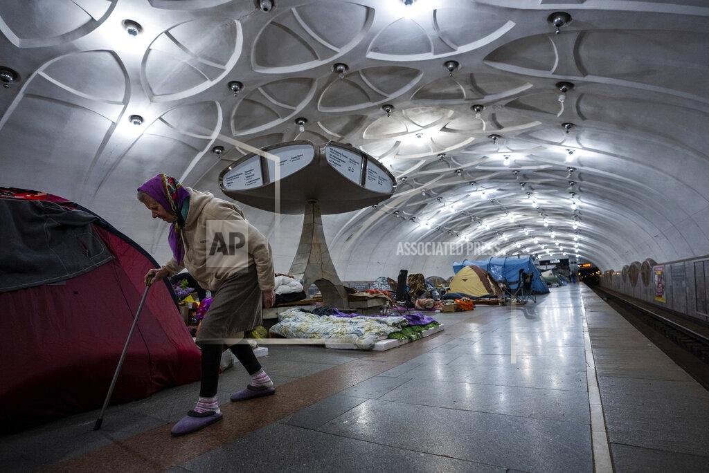 Mstyslav Chernov An elderly woman walks inside a metro station being used as a bomb shelter in Kharkiv, Ukraine, Thursday, May 12, 2022. (AP Photo/Mstyslav Chernov)