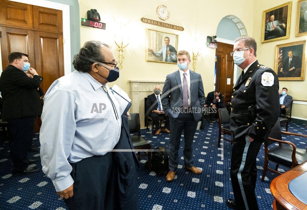 Bill Clark Chairman Raúl Grijalva, D-Ariz., left, speaks with Acting U.S. Park Police Chief Gregory T. Monahan, prior to a House Natural Resources Committee hearing on actions taken on June 1, 2020 at Lafayette Square, Tuesday, July 28, 2020 on Capitol Hill in Washington. (Bill Clark/Pool via AP)