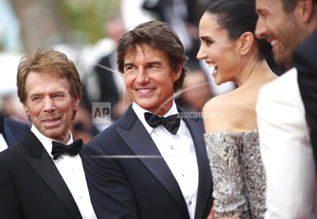Vianney Le Caer Jerry Bruckheimer, from left, Tom Cruise, Jennifer Connelly, and Glen Powell pose for photographers upon arrival at the premiere of the film 'Top Gun: Maverick' at the 75th international film festival, Cannes, southern France, Wednesday, May 18, 2022. (Photo by Vianney Le Caer/Invision/AP)