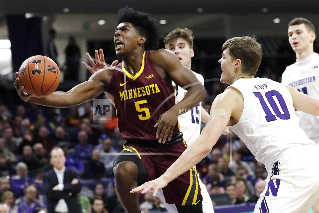 Nam Y. Huh Minnesota guard Marcus Carr, left, drives to the basket past Northwestern forward Miller Kopp (10) and center Ryan Young (15) during the first half of an NCAA college basketball game in Evanston, Ill., Sunday, Feb. 23, 2020. (AP Photo/Nam Y. Huh)