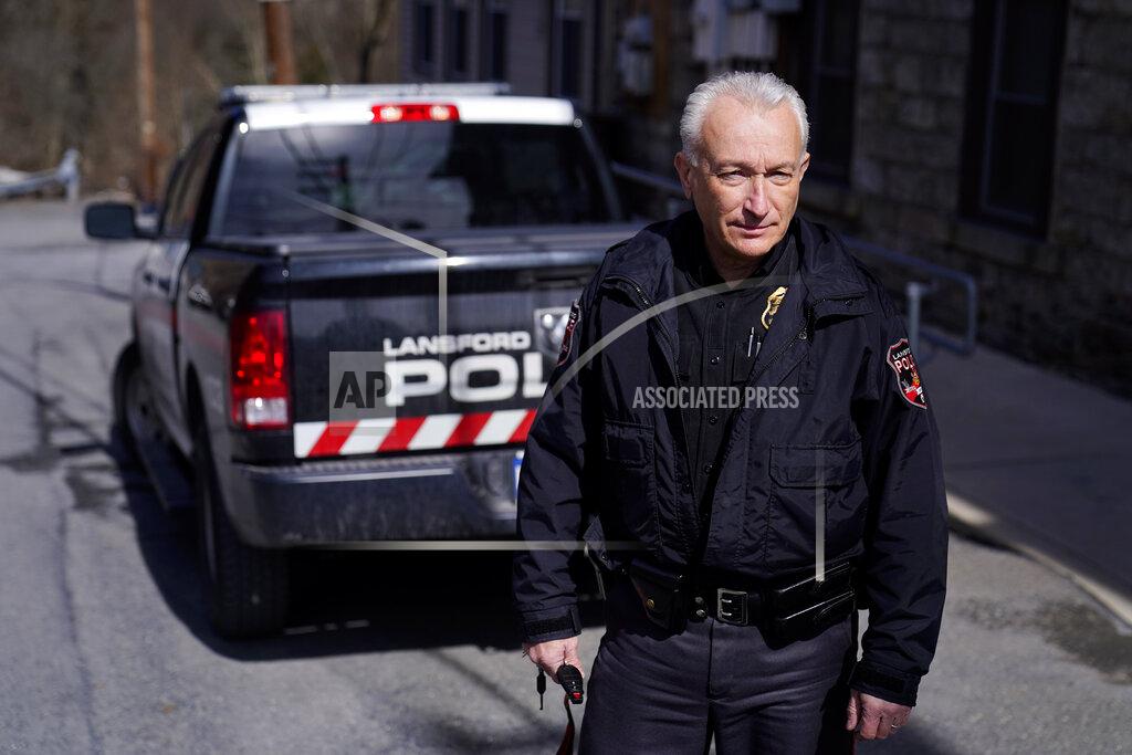 Matt Slocum Lansford Police Chief Jack Soberick stands next to his truck, Friday, March 12, 2021, in Lansford, Pa. On May 26, 2020, police found 9-year-old Ava Lerario; her mother, Ashley Belson, and Ava's father, Marc Lerario, fatally shot inside their home. Soberick was the first to respond to the scene. "I don't believe this would have happened this way if not for the pandemic pushing him beyond the brink," Soberick said of Marc Lerario. "I wish Marc would have gotten treatment for the bipolar disorder." (AP Photo/Matt Slocum)