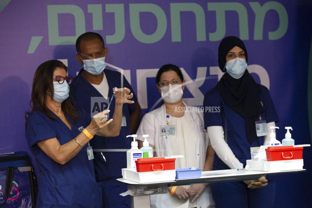 Maya Alleruzzo Medical staff prepare COVID-19 vaccines for Israeli President Isaac Herzog and his wife at the Sheba Medical Center in Ramat Gan, Israel, Friday, July 30, 2021. (AP Photo/Maya Alleruzzo, Pool)