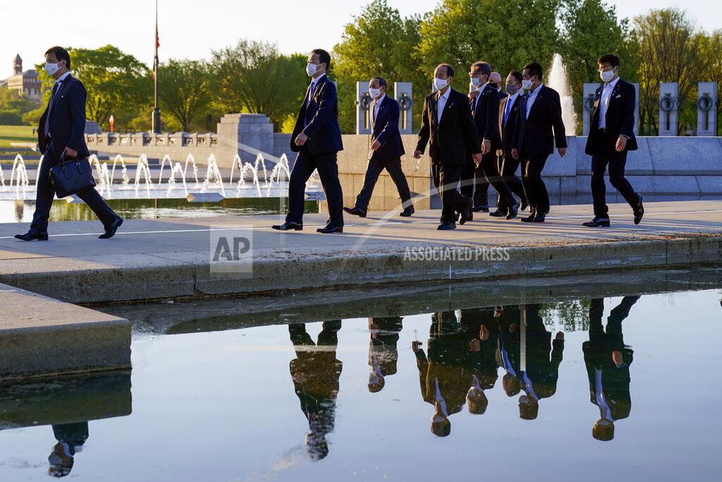 Alex Brandon Japanese Prime Minister Yoshihide Suga visits the World War II Memorial, Saturday, April 17, 2021, in Washington. (AP Photo/Alex Brandon)