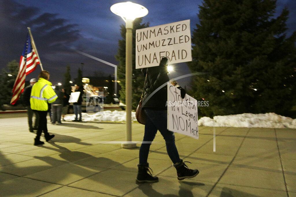 Young Kwak A person protests the revocation of former Gonzaga player John Stockton's season tickets due to his refusal to follow the mask mandate, outside the McCarthey Athletic Center before an NCAA college basketball game between Gonzaga and Portland, Jan. 29, 2022, in Spokane, Wash. (AP Photo/Young Kwak)