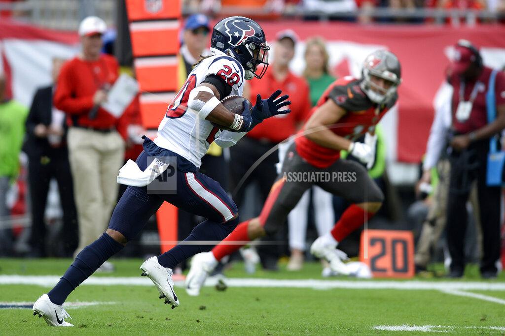 Jason Behnken Houston Texans strong safety Justin Reid (20) runs with the football after intercepting a pass by Tampa Bay Buccaneers quarterback Jameis Winston during the first half of an NFL football game Saturday, Dec. 21, 2019, in Tampa, Fla. (AP Photo/Jason Behnken)