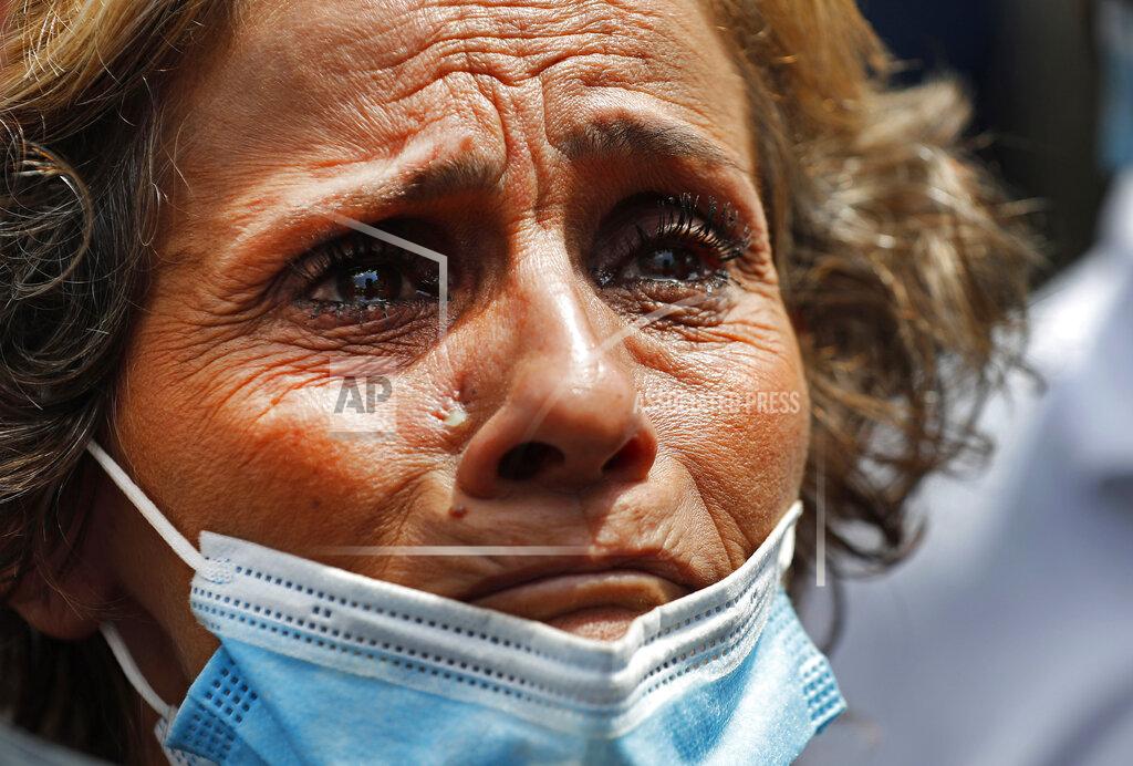 Hussein Malla FILE - In this August 6, 2020 file photo, a Lebanese woman whose son is missing during the massive explosion that hit the seaport of Beirut, cries as she waits outside the port to receive any information from the rescue teams, in Beirut, Lebanon. The mental health impact of the Beirut explosion that killed more than 200 and wounded more than 6,000 continues to lay its heavy weight on those who managed to survive the day. (AP Photo/Hussein Malla, File)