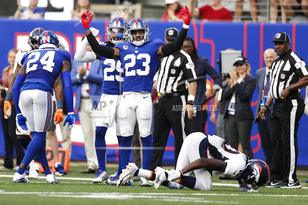 Adam Hunger Denver Broncos wide receiver Jerry Jeudy (10) reacts after he was injured on a play after he was tackled by New York Giants' Logan Ryan (23) and James Bradberry (24) during the second half of an NFL football game Sunday, Sept. 12, 2021, in East Rutherford, N.J. (AP Photo/Adam Hunger)