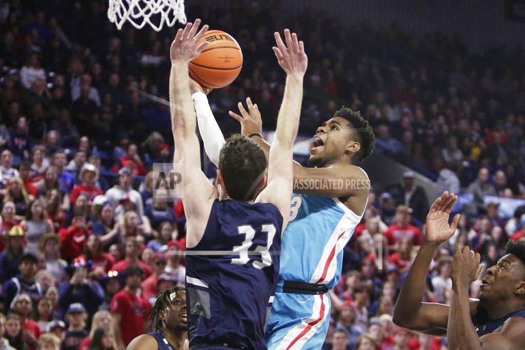 Young Kwak Gonzaga guard Malachi Smith, right, shoots while defended by North Florida guard Oscar Berry during the first half of an NCAA college basketball game, Monday, Nov. 7, 2022, in Spokane, Wash. (AP Photo/Young Kwak)