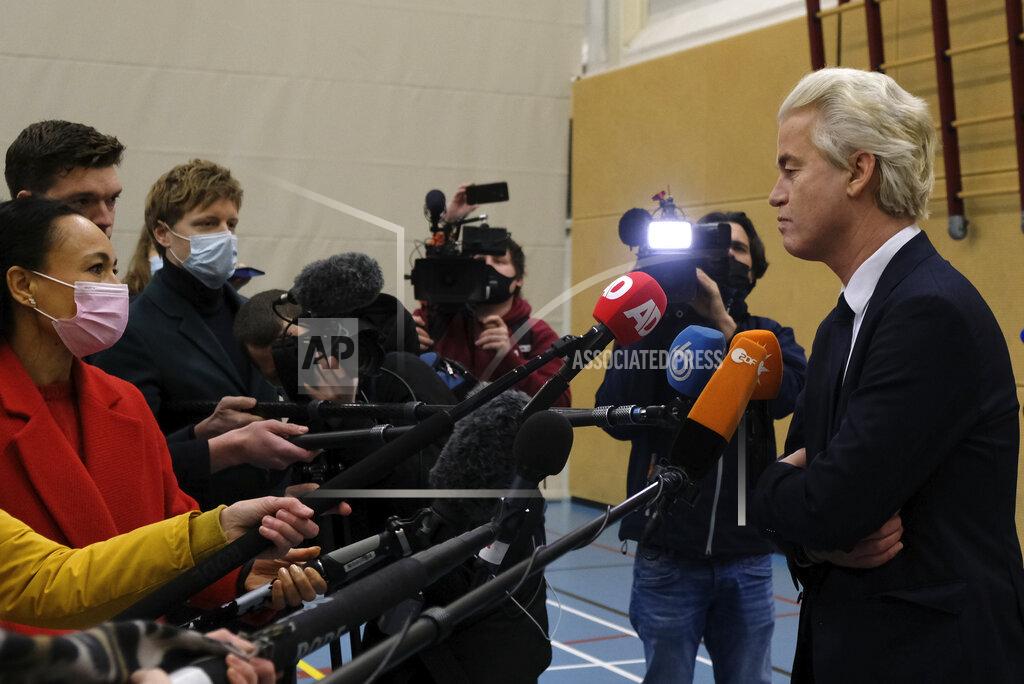 Patrick Post Populist Dutch anti-immigration lawmaker Geert Wilders answers reporters after casting his vote in a general election in The Hague, Wednesday, March 17, 2021. Polling stations have opened opened across the Netherlands from Monday in a general election that has been spread over three days to allow people to vote safely during the coronavirus pandemic. (AP Photo/Patrick Post)