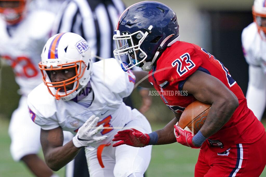 Rogelio V. Solis Jackson State running back Kymani Clarke (23) runs past an Edward Waters defender during the first half of an NCAA college football game in Jackson, Miss., Sunday, Feb. 21, 2021. The game marks Sanders's collegiate head coaching debut. (AP Photo/Rogelio V. Solis)