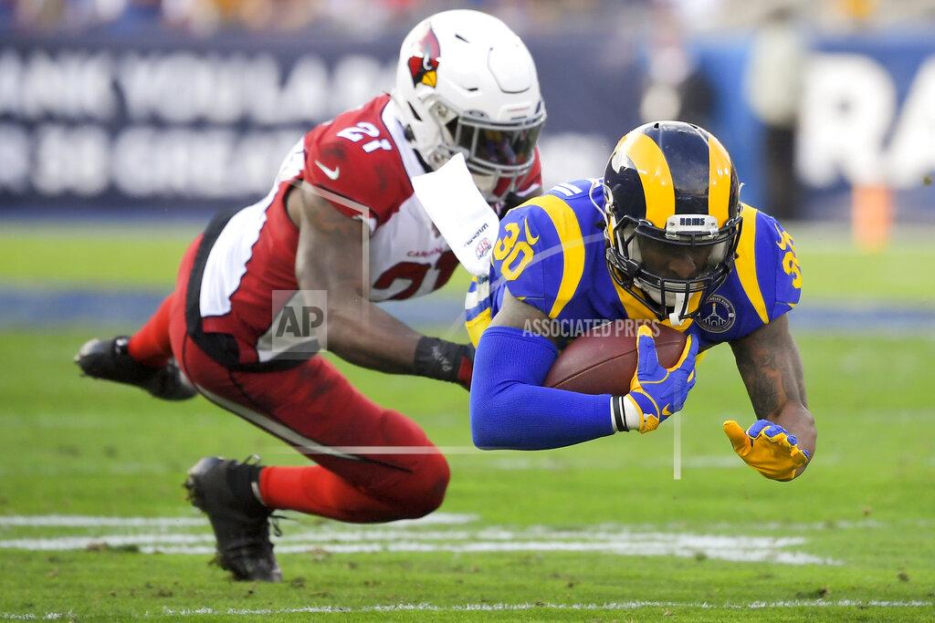 Mark J. Terrill Los Angeles Rams running back Todd Gurley, right, is tackled by Arizona Cardinals cornerback Patrick Peterson during first half of an NFL football game Sunday, Dec. 29, 2019, in Los Angeles. (AP Photo/Mark J. Terrill)