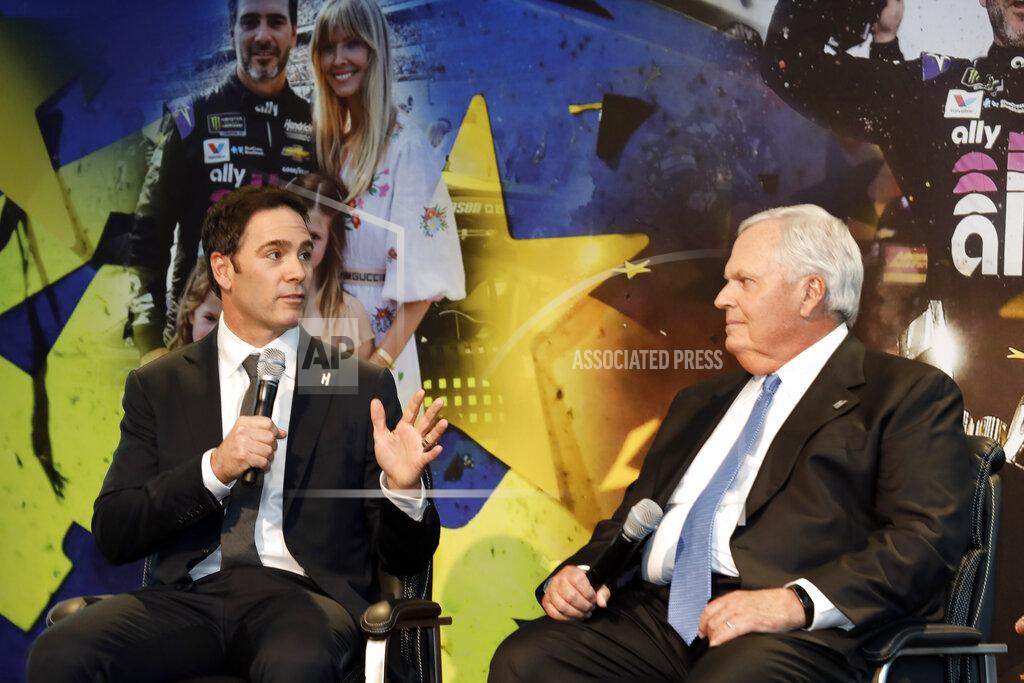 Bob Leverone Jimmie Johnson, left, looks to team owner Rick Hendrick as he answers a reporter's question during his NASCAR retirement announcement at Hendrick Motorsports near Charlotte, N.C., Thursday, Nov. 21, 2019. (AP Photo/Bob Leverone)