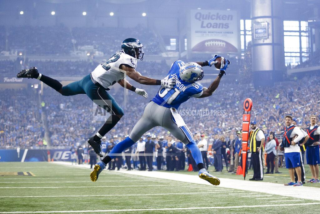 Rick Osentoski FILE - In this Nov. 26, 2015, file photo, Detroit Lions wide receiver Calvin Johnson (81), defended by Philadelphia Eagles cornerback Eric Rowe (32) , catches a pass for a touchdown during the second half of an NFL football game, in Detroit. Calvin Johnson is simply in awe that he will soon join Jim Brown and Gale Sayers as Pro Football Hall of Famers inducted at the age of 35 years old or younger. (AP Photo/Rick Osentoski, File)