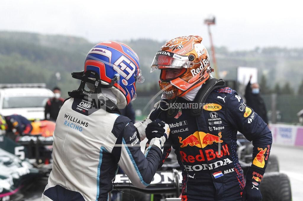John Thys First place for pole position Red Bull driver Max Verstappen of the Netherlands, right, congratulates second place, Williams driver George Russell of Britain after the qualification ahead of the Formula One Grand Prix at the Spa-Francorchamps racetrack in Spa, Belgium, Saturday, Aug. 28, 2021. The Belgian Formula One Grand Prix will take place on Sunday. (John Thys, Pool Photo via AP)