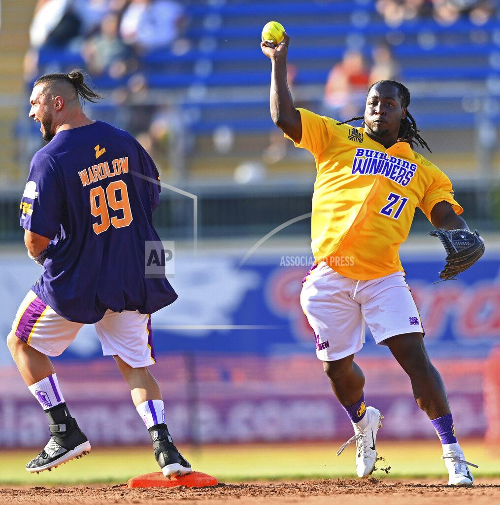 David Dermer Cleveland Browns running back Kareem Hunt throws to first after forcing out professional wrestler Michael Wardlow during the Jarvis Landry Celebrity Softball game Saturday, June 12, 2021 in Eastlake, Ohio. (AP Photo/David Dermer)