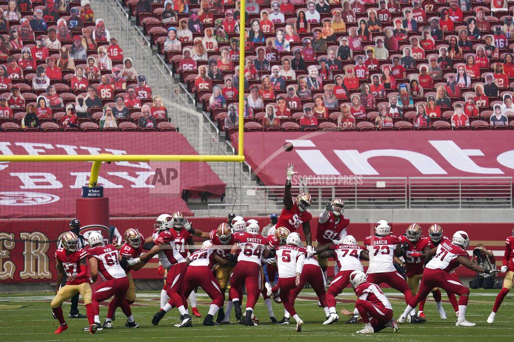 Tony Avelar Cutouts are seated at Levi's Stadium as Arizona Cardinals kicker Zane Gonzalez (5) kicks a point after try during the first half of an NFL football game against the San Francisco 49ers in Santa Clara, Calif., Sunday, Sept. 13, 2020. (AP Photo/Tony Avelar)
