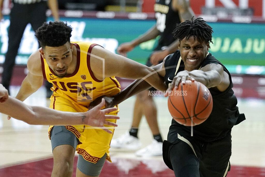 Jae C. Hong Colorado's Jabari Walker, right, and Southern California's Isaiah Mobley go after a loose ball during the second half of an NCAA college basketball game Thursday, Dec. 31, 2020, in Los Angeles. Colorado won 72-62. (AP Photo/Jae C. Hong)