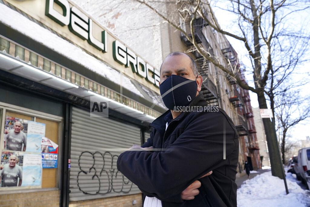Kathy Willens Bodega owner Frank Marté Wednesday, Feb. 10, 2021, in the Bronx borough of New York. Marté heads up the head of the Bodega and Small Business Group, which represents bodegas in New York. He said he has been lobbying local officials to set aside COVID-19 vaccine appointments for bodega workers, many of whom are unaware they are eligible. He hopes the recent opening of a large vaccination site at Yankee stadium will make access easier for people like him. (AP Photo/Kathy Willens)