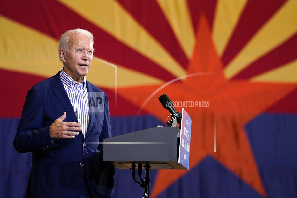 Carolyn Kaster FILE - In this Oct. 8, 2020, file photo Democratic presidential candidate former Vice President Joe Biden speaks at the Carpenters Local Union 1912 in Phoenix. New census data that reassigned states’ votes in Electoral College didn’t upend Democrats’ or Republicans’ basic strategies for securing 270 votes needed to win the White House. But it hints at new paths not too far off. The 2020 census count will require a shift in congressional representation away from Rust Belt of the upper Midwest toward the southern Sun Belt. (AP Photo/Carolyn Kaster, File)