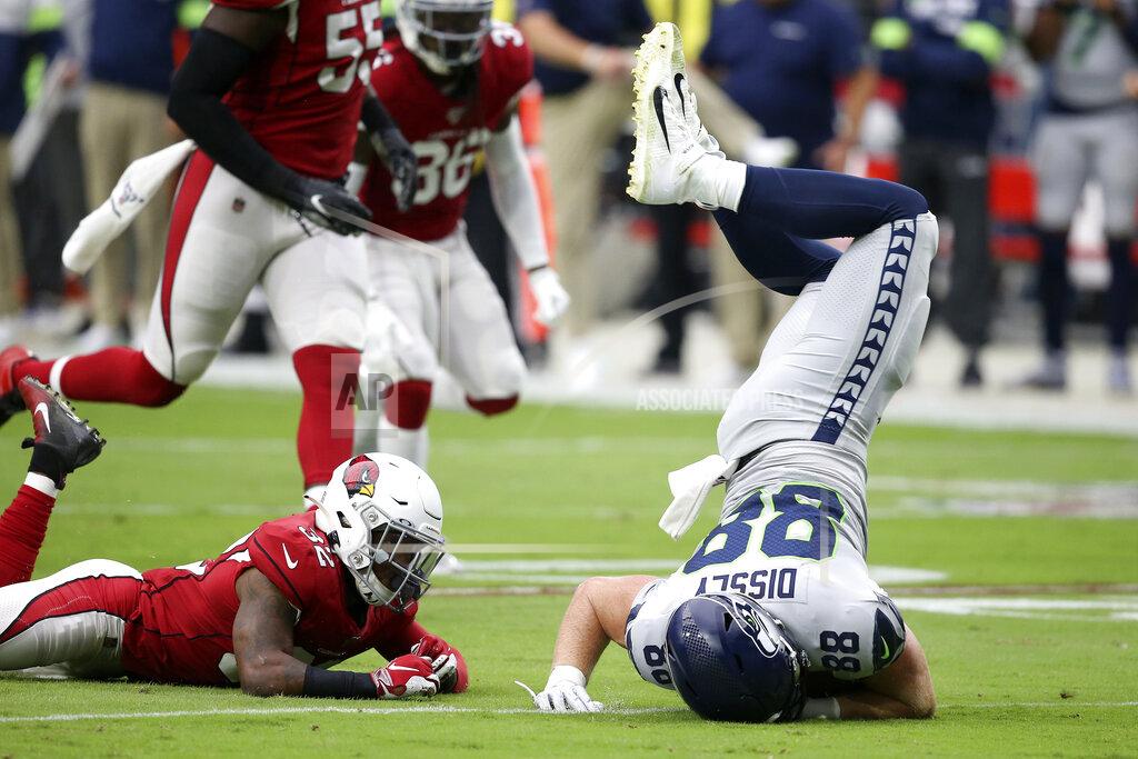 Ross D. Franklin Seattle Seahawks tight end Will Dissly (88) is tackled by Arizona Cardinals strong safety Budda Baker (32) during the first half of an NFL football game, Sunday, Sept. 29, 2019, in Glendale, Ariz. (AP Photo/Ross D. Franklin)
