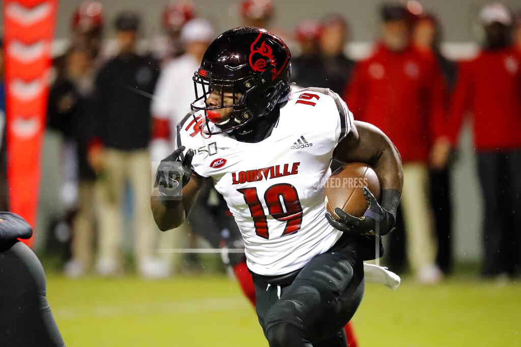Karl B Deblaker Louisville's Hassan Hall (19) runs the ball against North Carolina State during the first half of an NCAA college football game in Raleigh, N.C., Saturday, Nov. 16, 2019. (AP Photo/Karl B DeBlaker)