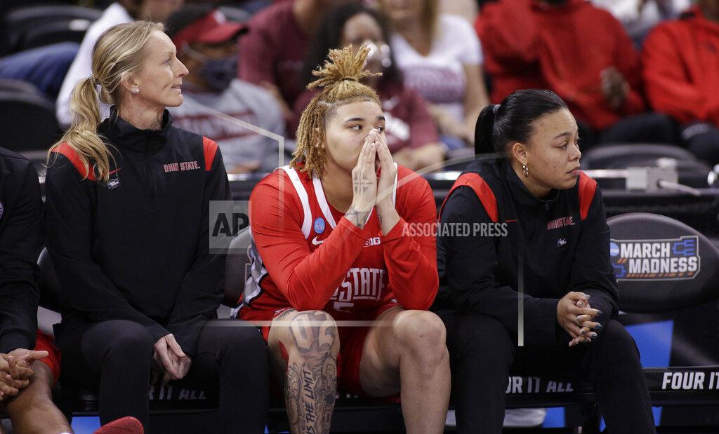 Young Kwak Ohio State guard Kateri Poole (5), center, sits with coaches on the bench late in the second half of a college basketball game against Texas in the Sweet 16 round of the NCAA tournament, Friday, March 25, 2022, in Spokane, Wash. Texas won 66-63. (AP Photo/Young Kwak)