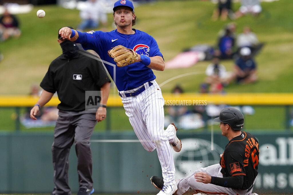 Matt York Chicago Cubs' Nico Hoerner forces out San Francisco Giants' Mike Yastrzemski (5) as he turns a double play on Donovan Solano during the second inning of a spring training baseball game, Friday, March 26, 2021, in Mesa, Ariz. (AP Photo/Matt York)