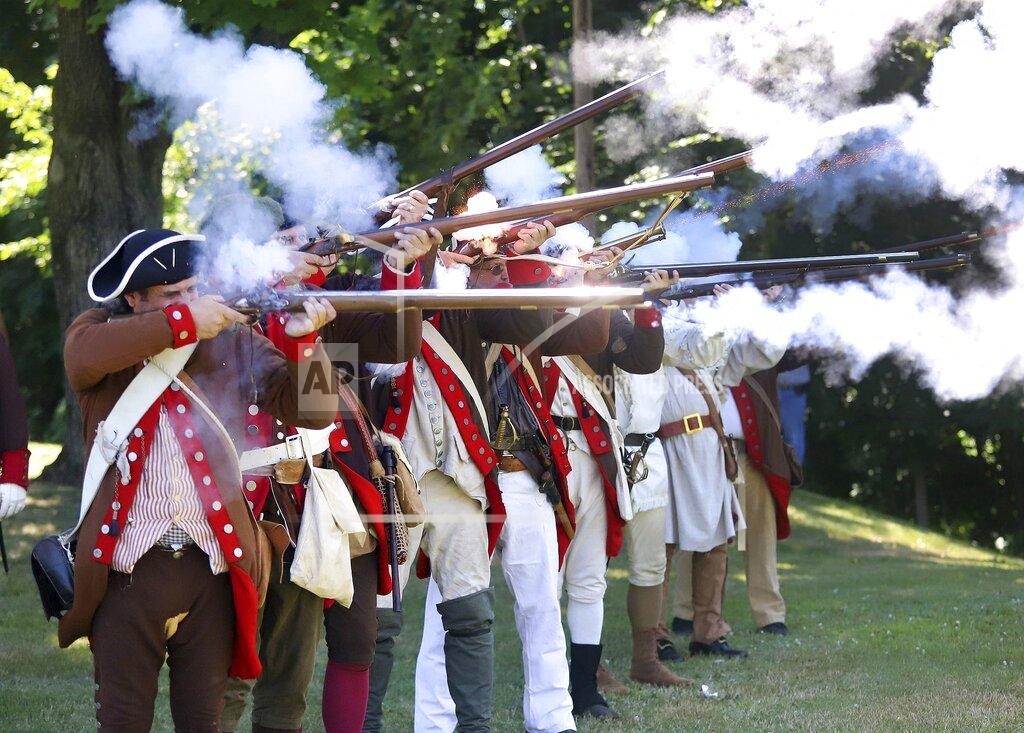 Dave Scherbenco Members of the 24th Connecticut Militia fire a volley during the 144th annual Commemorative Service for the Battle and Massacre of Wyoming held on the grounds of the Wyoming Monument Monday, July 4, 2022, in Wyoming Pa. (Dave Scherbenco/The Citizens' Voice via AP)