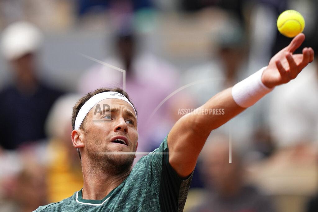 Michel Euler Norway's Casper Ruud serves against France's Jo-Wilfried Tsonga during their first round match at the French Open tennis tournament in Roland Garros stadium in Paris, France, Tuesday, May 24, 2022. (AP Photo/Michel Euler)