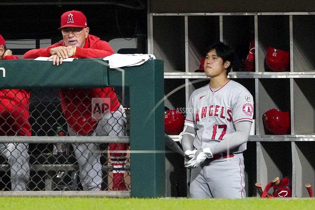 Charles Rex Arbogast Los Angeles Angels manager Joe Maddon, left, and designated hitter Shohei Ohtani watch from the dugout during the fourth inning of the team's baseball game against the Chicago White Sox on Wednesday, Sept. 15, 2021, in Chicago. (AP Photo/Charles Rex Arbogast)