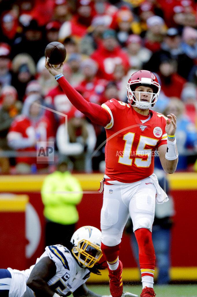 Charlie Riedel Kansas City Chiefs quarterback Patrick Mahomes (15) throws a pass in front of Los Angeles Chargers defensive end Melvin Ingram III (54) during the first half of an NFL football game in Kansas City, Mo., Sunday, Dec. 29, 2019. (AP Photo/Charlie Riedel)