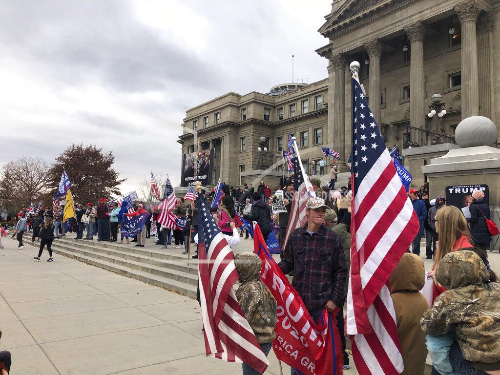 Supporters of President Donald Trump, few wearing masks, gathered at the Idaho Statehouse steps in Boise, Idaho, on Saturday Nov. 7, 2020, to protest Trump's loss in the Nov. 3 election for a second term.(AP Photo/Keith Ridler)
