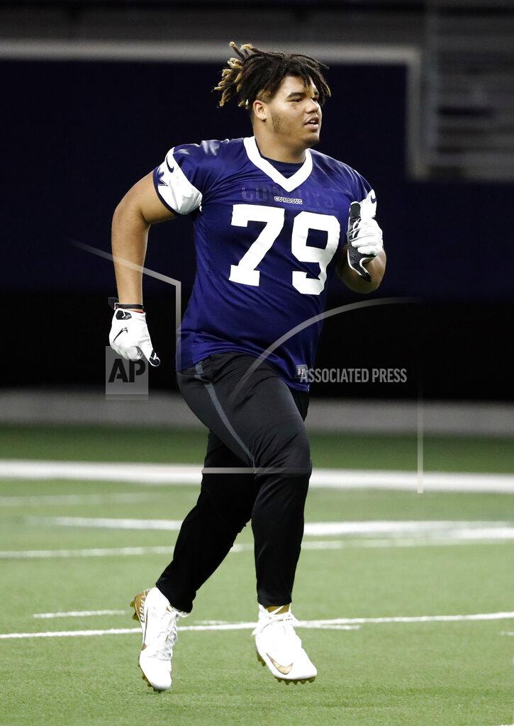 Tony Gutierrez Dallas Cowboys rookie defensive tackle Trysten Hill jogs across the field at the end of the NFL football team's minicamp in Frisco, Texas, Friday, May 10, 2019. (AP Photo/Tony Gutierrez)