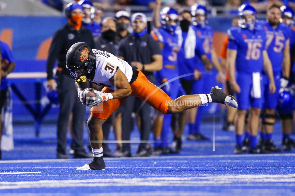 Steve Conner Oklahoma State safety Kolby Harvell-Peel makes an interception against Boise State during the second half of an NCAA college football game Saturday, Sept. 18, 2021, in Boise, Idaho. (AP Photo/Steve Conner)