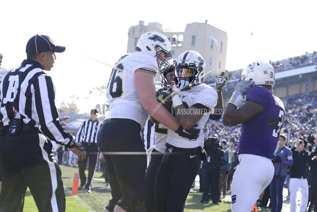 Paul Beaty Purdue wide receiver Amad Anderson (10) celebrates with teammates Mark Stickford (76) and King Doerue (22) after Anderson caught a touchdown pass during the second half of an NCAA college football game against Northwestern Saturday, Nov. 9, 2019, in Evanston, Ill. Purdue won 24-22. (AP Photo/Paul Beaty)