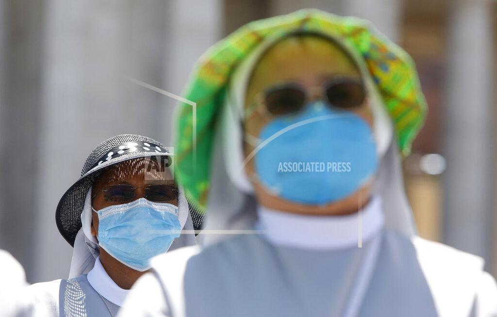 Riccardo De Luca Nuns wearing protective masks attend the Angelus prayer celebrated by Pope Francis from his studio window overlooking St. Peter's Square at the Vatican, Sunday, July 5, 2020. (AP Photo/Riccardo De Luca)
