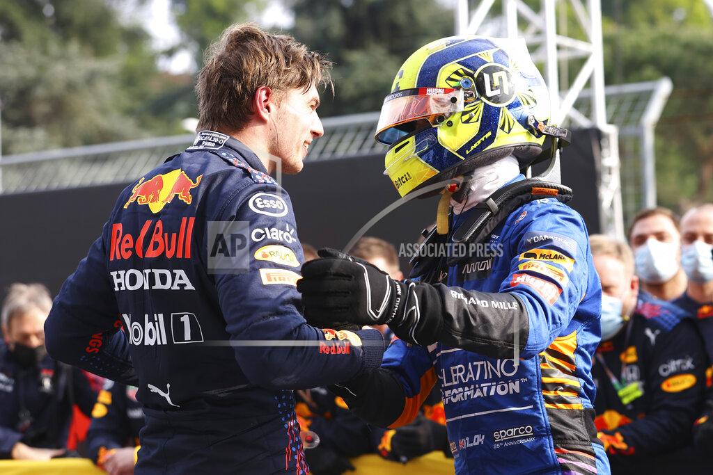 Bryn Lennon First placed Red Bull's Max Verstappen, left, greets third placed McLaren's Lando Norris at the end of the Emilia Romagna Formula One Grand Prix, at the Imola racetrack, Italy, Sunday, April 18, 2021. (Bryn Lennon/ Pool Via AP)