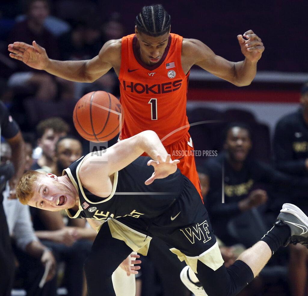 Matt Gentry Cameron Hildreth (2) of Wake Forest intercepts a pass intended for Virginia Tech's David N'Guessan (1) for a turnover in the first half of an NCAA college basketball game in Blacksburg, Va. Saturday, Dec. 4 2021. (Matt Gentry/The Roanoke Times via AP)