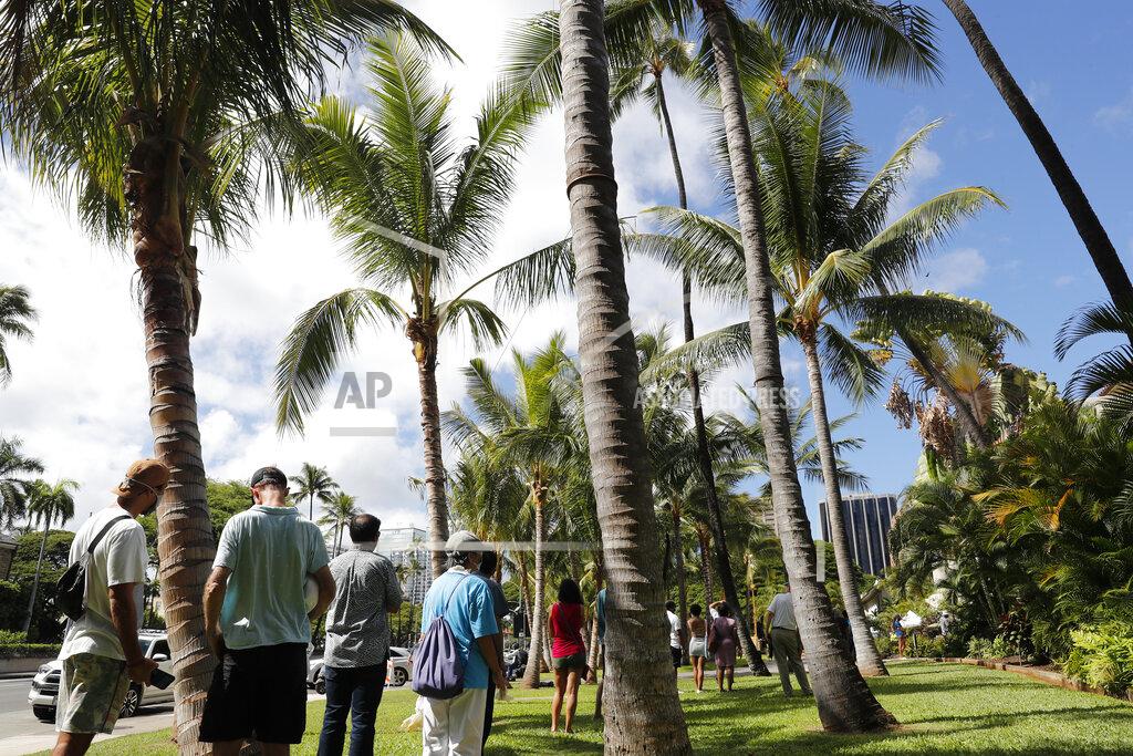 Marco Garcia People line up to vote on Election Day, Tuesday, Nov. 3, 2020, in Honolulu. (AP Photo/Marco Garcia)