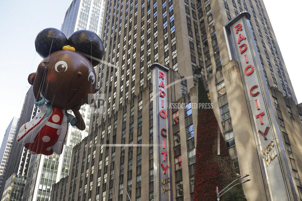 Jeenah Moon The Ada Twist, Scientist balloon floats past Radio City Music Hall during the Macy's Thanksgiving Day Parade, Thursday, Nov. 24, 2022, in New York. (AP Photo/Jeenah Moon)