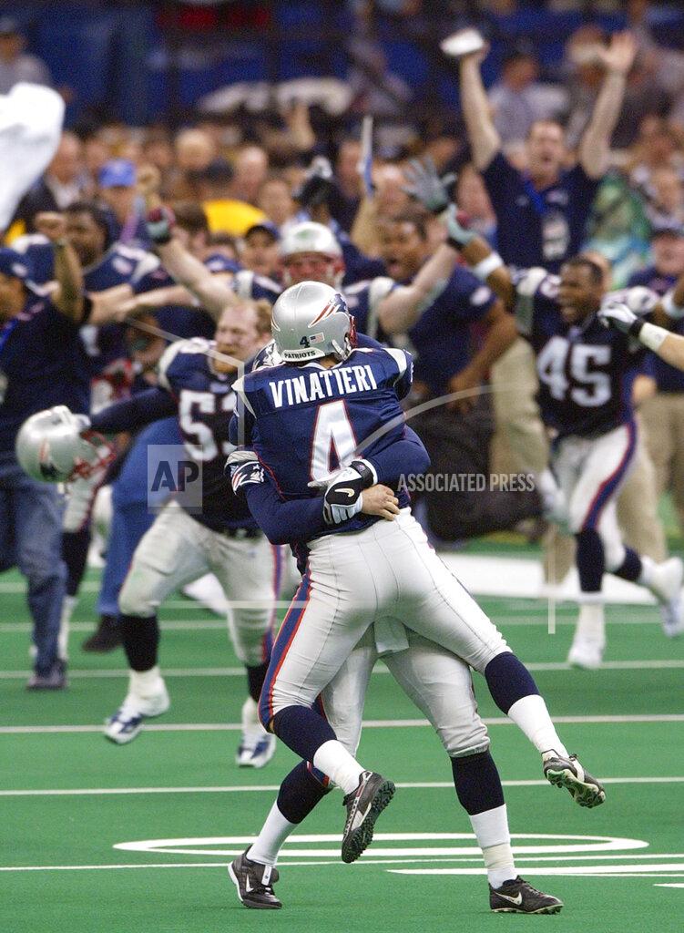 Kathy Willens FILE - In this Feb. 3, 2002, file photo, New England Patriots' Adam Vinatieri (4) is lifted into the air as his teammates charge the field after his game-winning 48-yard field goal beat the St. Louis Rams 20-17 in NFL football Super Bowl 36 in New Orleans. A pair of Super Bowl winning teams that launched dynasties in San Francisco and New England highlighted the list of the NFL's greatest teams, numbers 31-100. The Patriots won a surprise title in 2001 after the untested Tom Brady took over from the injured Drew Bledsoe early in the season. New England needed a favorable ruling and dramatic kick by Adam Vinatieri to win the "Tuck Rule" game against Oakland, won at Pittsburgh in the AFC championship game and slowed down the dynamic Rams offense for the franchise's first title. That team ranked 51st. (AP Photo/Kathy Willens, File)